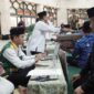 Bupati Kukar, Edi Damansyah saat melakukan pembayaran Zakat. (Foto: Ist)